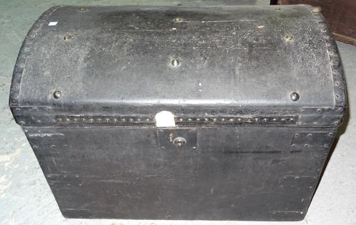 An early 20th century metal studded faux leather domed top trunk, 71cm wide x 55cm high.  K8