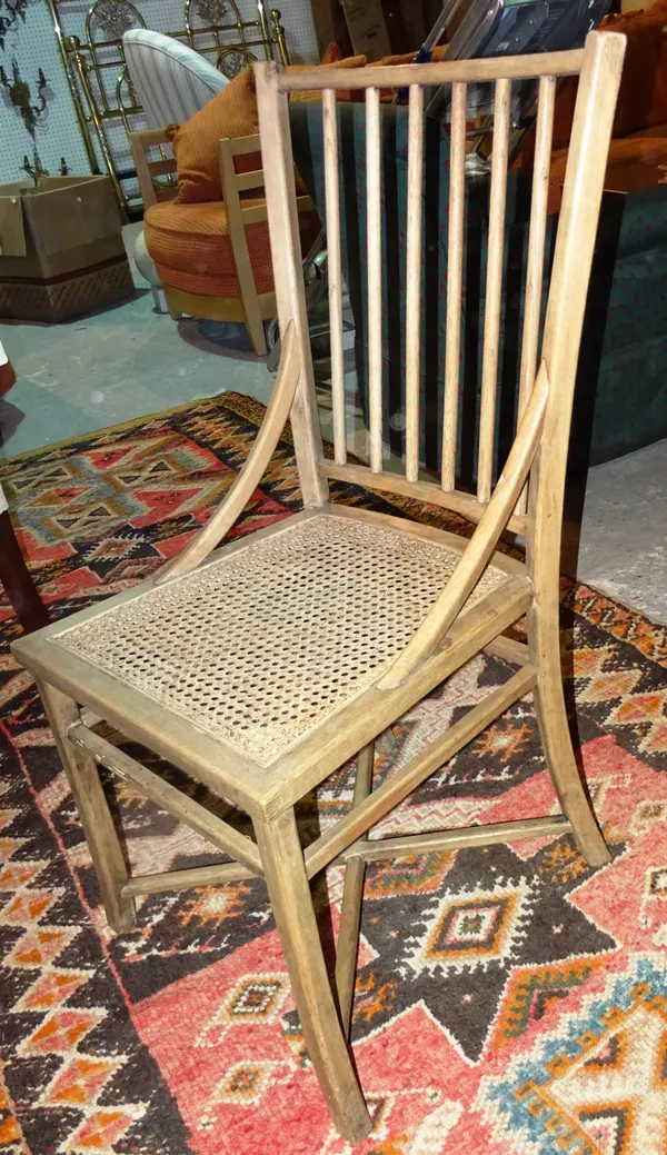 A set of six 20th century limed oak stick back dining chairs, (6), (a.f.).   G8
