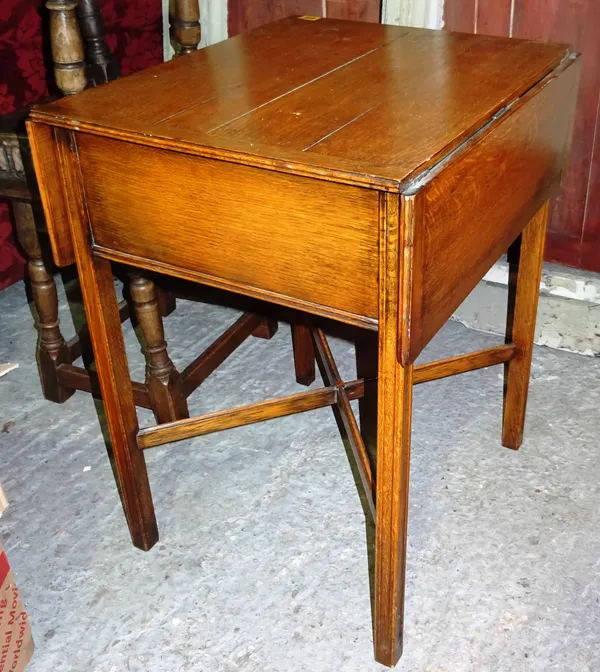 A 20th century oak drop flap occasional table, with single drawer and 'X' frame stretcher, 56cm wide.  K7