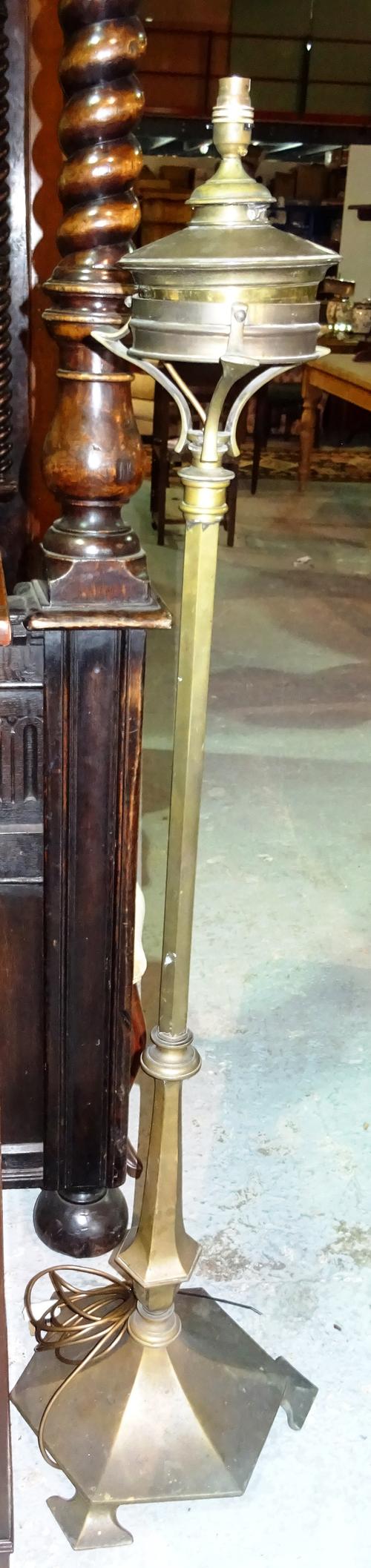 An Arts & Crafts style brass standard lamp, with octagonal base, formerly an oil lamp, 144cm high.  C9
