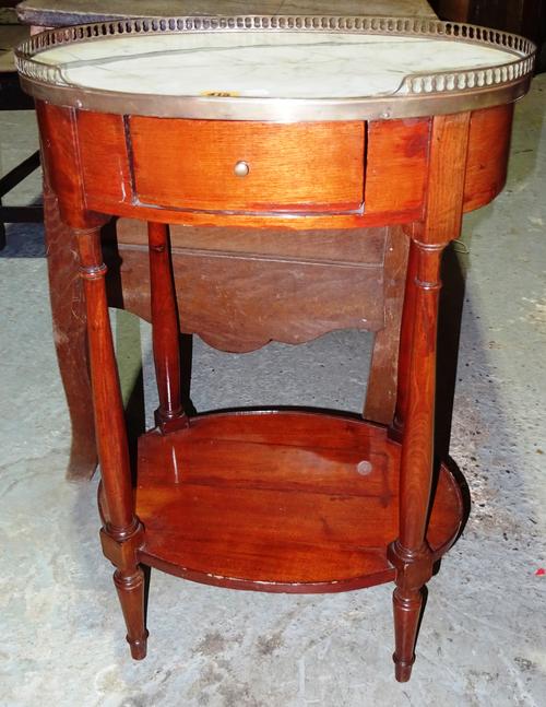 A Louis XVI style walnut oval two tier occasional table, with marble top and brass gallery, 49cm wide.  M2
