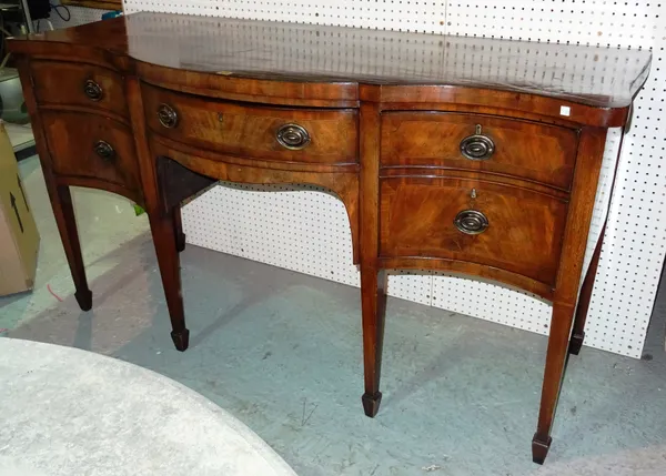 A 19th century mahogany serpentine sideboard, on square tapering supports, 170cm wide.  E5