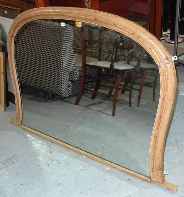 An early 20th century pine overmantel mirror, of pinched form, 108cm wide x 85cm high.  CAB