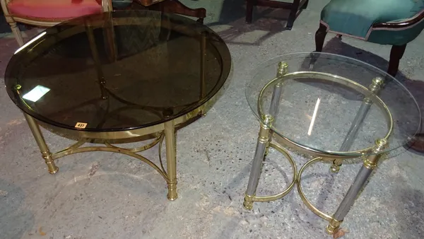 A 20th century brass circular coffee table, with shadowed glass top, 85cm wide x 50cm high, together with another smaller brass and glass table, 45cm