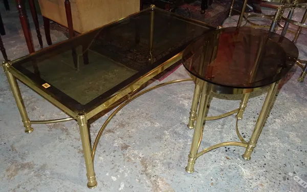 A 20th century brass rectangular coffee table, with glass top, 110cm wide x 45cm high, together with a 20th brass oval side table, 56cm wide x 60cm hi