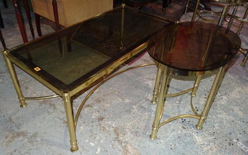 A 20th century brass rectangular coffee table, with glass top, 110cm wide x 45cm high, together with a 20th brass oval side table, 56cm wide x 60cm hi