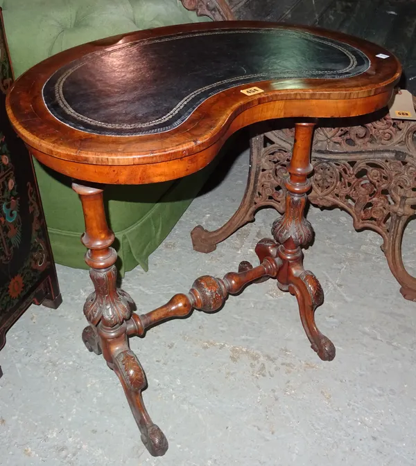 A Victorian walnut kidney shaped writing table, with bulbous turned stretcher, 67cm wide x 70cm high.  F6