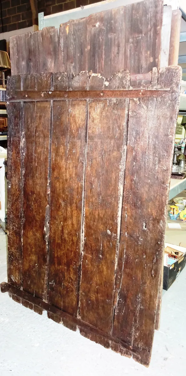 A group of four 18th century and later iron bound oak doors, with strap hinges, 108cm wide x 180cm high (4).  F3