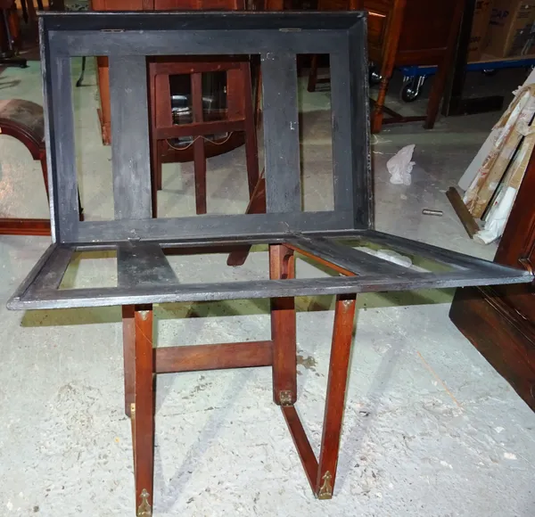 An early 20th century walnut and black painted folding folio stand, 86cm wide.  M6