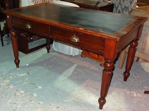 An early 20th century oak rectangular side table, with pair of frieze drawers on turned supports, 135cm wide.  K9