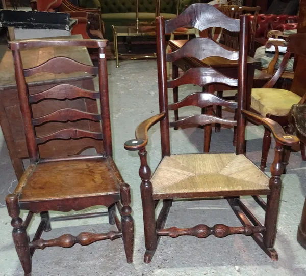 An early 19th century ash Lancashire ladder back open arm rocking chair, together with another ladder back chair, (2).  J3