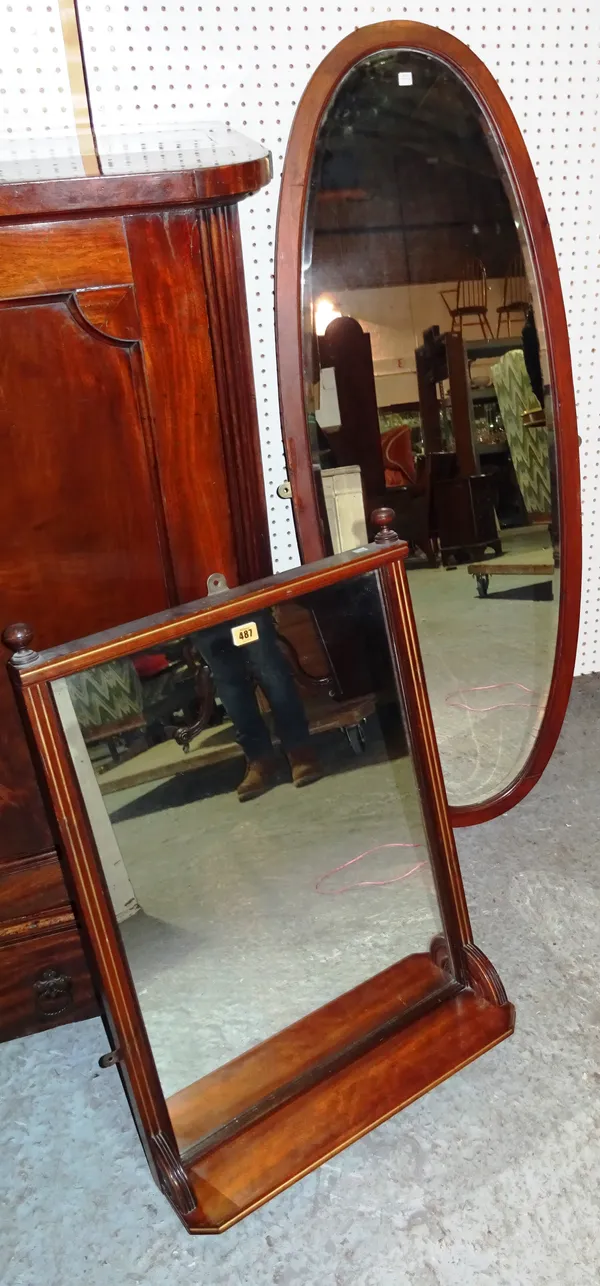 An early 20th century mahogany overmantel mirror, with integral shelf, 52cm wide x 75cm high, together with a 20th century mahogany oval wall mirror,