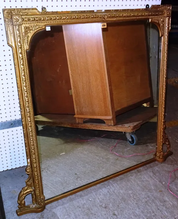 An early 20th century gilt framed overmantel mirror, with floral swag decoration, 104cm wide x 101cm high.  J10