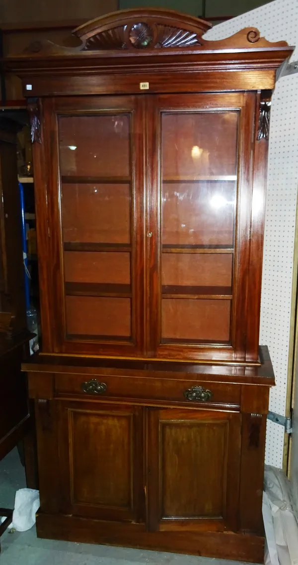 A Victorian style mahogany bookcase cabinet, with glazed top section and cupboard base, 104cm wide x 203cm high.  M7