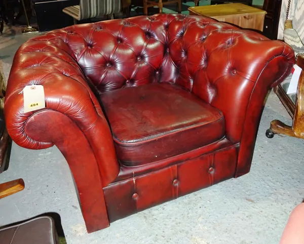 A 20th century button back red leather club armchair.  I5