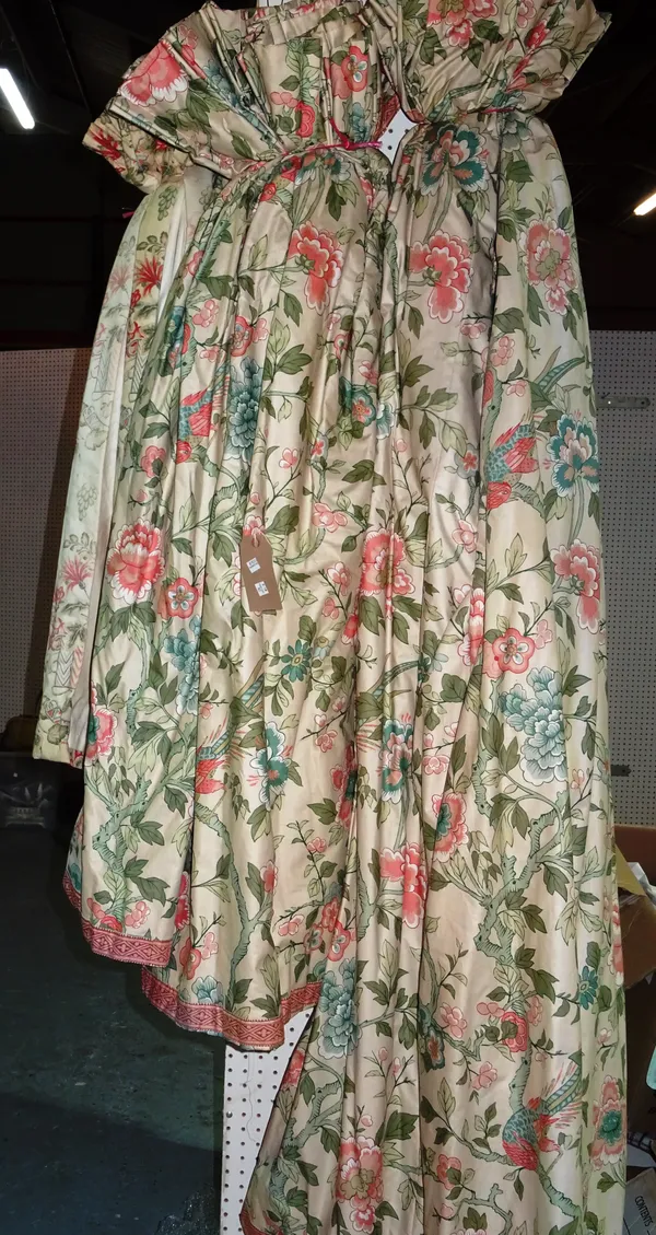 Curtains, comprising; a pair of lined cream ground with pink and green fauna and flora decoration, 170cm wide x 210cm fall and another similar, 160cm
