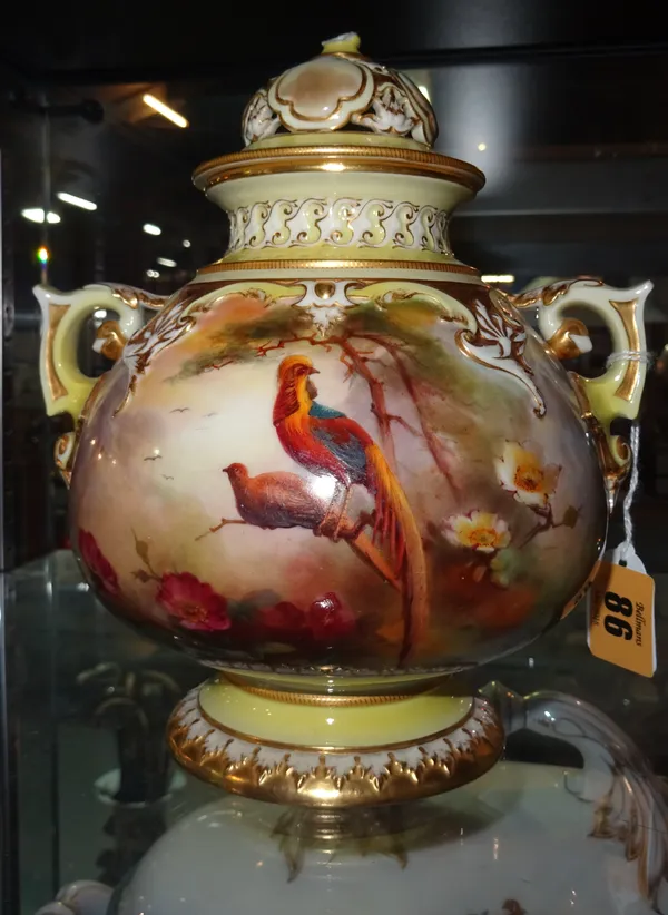 A Worcester Hadley ware two handled vase and cover by J.W. Sedgley, decorated with exotic birds against a gilt and yellow ground (a.f), 19cm high. CAB