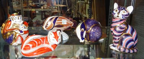 Five Royal Crown Derby Imari paperweights (lacking gold button), comprising; a monkey group, a seated cat, a fox, a tropical fish and a badger, (5).