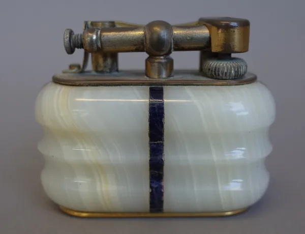 A Dunhill onyx and lapis lazuli inlaid table lighter, circa 1950, with a gilt metal mechanism, stamped 'DUNHILL LIGHTER' to base, 9.5cm wide.