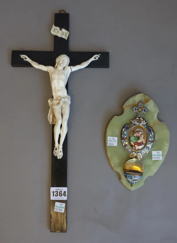 A Dieppe carved ivory crucifix figure of Christ on an ebonised wooden cross, 43cm high and a champlevé enamel and brass decorated onyx stoop dated 190
