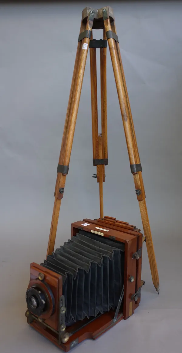 J. Lancaster & Son Birmingham, a mahogany cased plate camera on oak tripod stand with inset plaque detailed 'The 1893 Instantograph Patent', 8 inches
