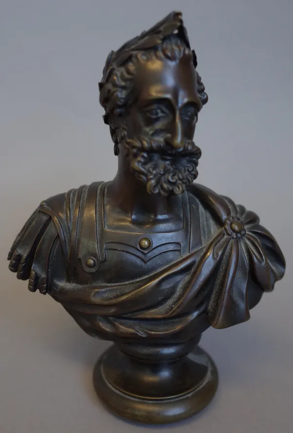 A French bronze bust of a Roman male figure, 19th century, with laurel garland in his hair on a socle base, 17cm high and a pair of late 19th century