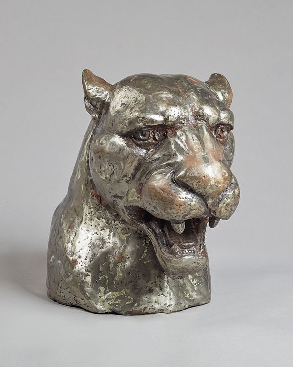 Untitled, Iron panthers head, unsigned. 42cm high. Illustrated.