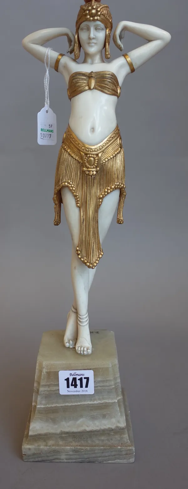 An Art Deco ivory and gilt metal mounted exotic dancer, on striated onyx plinth with later engraved 'D.H.Chiparus', signature, 41 cm high overall, (a.