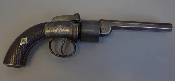 An English transitional revolver, 19th century, the octagonal steel barrel detailed 'IMPROVED REVOLVER', foliate engraved body and finely chequered tw