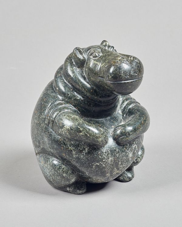 A Zimbabwean polished opal seated hippo, unsigned, 21cm high. Illustrated.