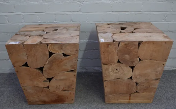 A pair of wooden garden seats or planters each made of log sections moulded into a square tapering form. 45 cm high