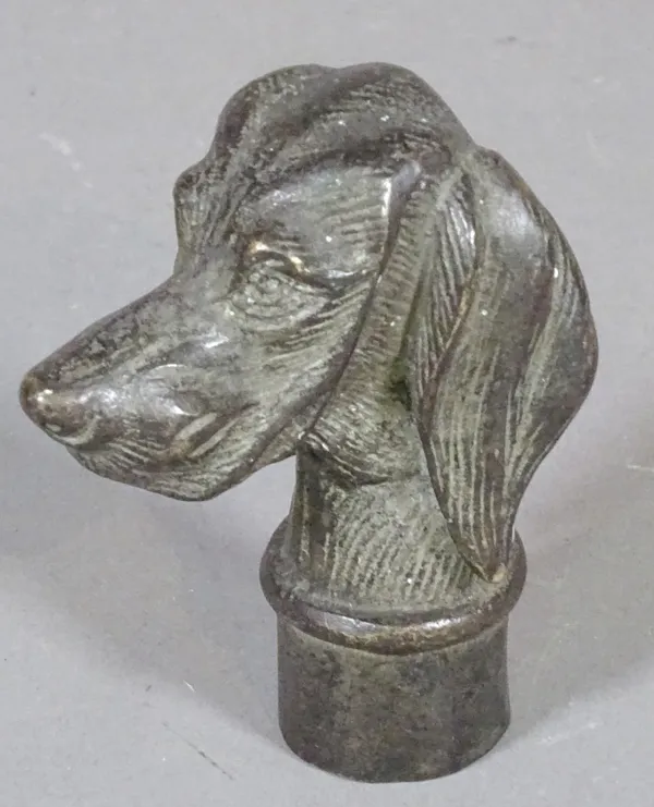 A 19th century bronze cane or parasol handle formed as a dog, 7cm long.    CAB