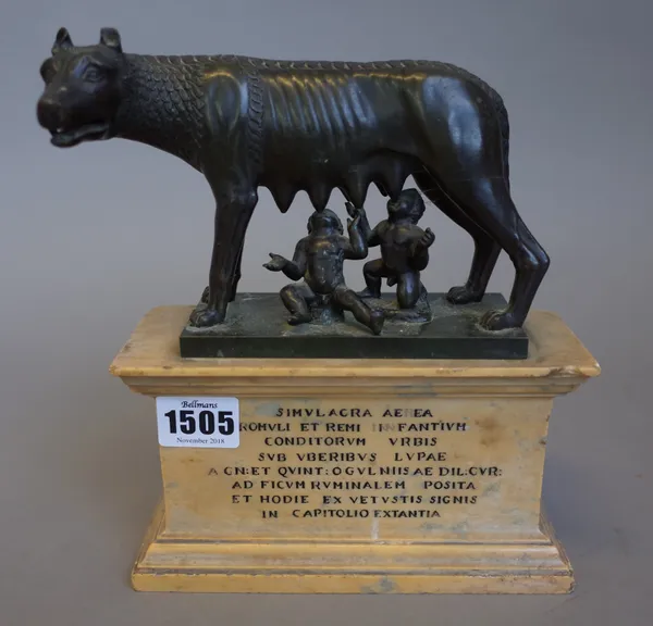 A 19th century continental bronze 'The Capitoline Wolf', after the Roman 11th/12th century original, on a variegated yellow marble plinth with Latin i