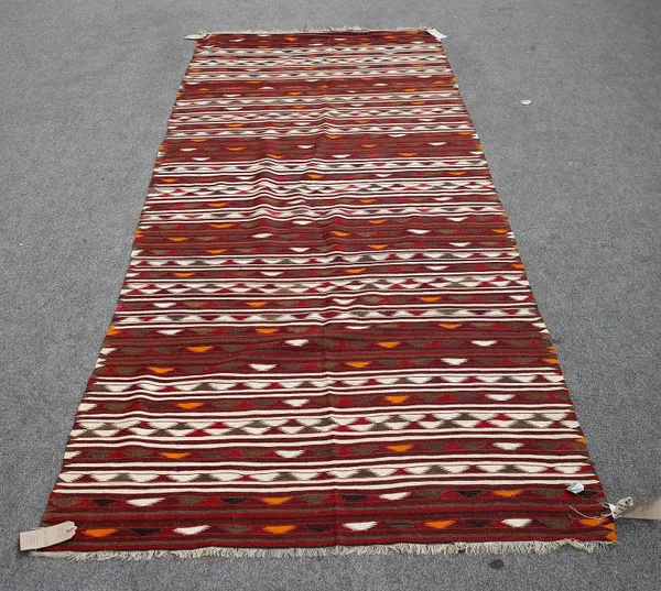 A Turkman flatweave, with banded design, 300cm x 120cm.