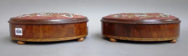 A pair of Victorian feather banded inlaid walnut oval foot stools, 30cm wide x 9cm high x 26cm deep (2).