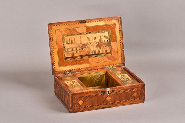 A late 18th century prisoner of war straw work box, the hinged rectangular top revealing a twin compartment interior, decorated with town scenes and f