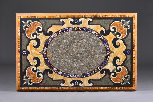 A 19th century rectangular specimen marble top with moulded edge, 137cm wide x 85cm deep. Illustrated.