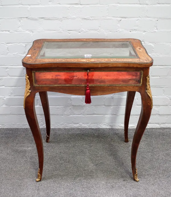A 19th century French marquetry inlaid bijouterie table, the rectangular serpentine top with bevelled glass panel on cabriole supports, 63cm wide x 75