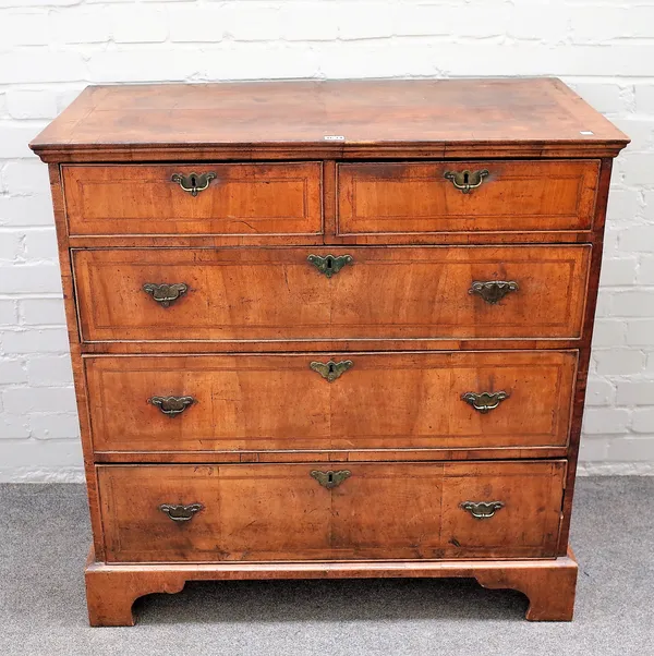 A George I featherbanded figured walnut chest of two short and three long graduated drawers on bracket feet, 97cm wide x 99cm high x 50cm deep.