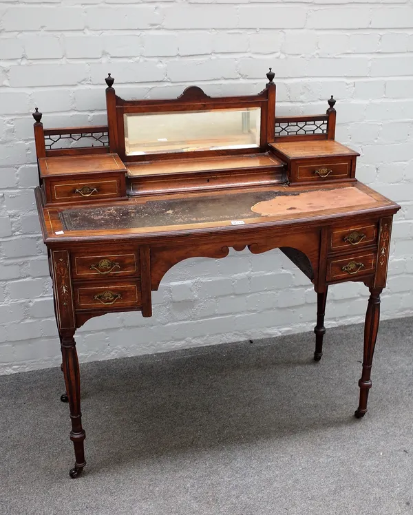 Jas Shoolbred & Co, a late 19th century inlaid rosewood bowfront lady's writing desk, with mirrored fitted super structure over four frieze drawers on