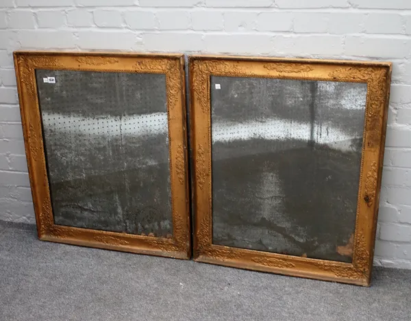 A pair of 19th century gilt framed rectangular wall mirrors with floral moulded framed and distressed mirror plate, 68cm wide x 82cm high.
