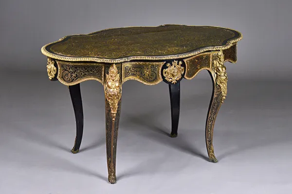 A Napoleon III gilt brass mounted tortoiseshell and brass boulle marquetry ebonised centre table, the lozenge shaped top with single frieze drawer on