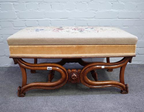 A mid-19th century walnut framed foot stool, the rectangular hinged lid top on a pair of compressed X-frame supports, 86cm wide x 46cm high x 42cm dee