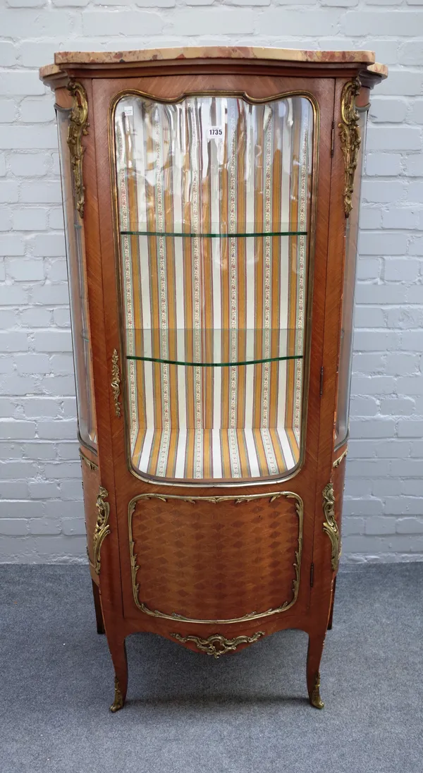 A late 19th century French vitrine, the marble top over a three quarter glazed gilt metal mounted parquetry inlaid kingwood base, on scroll supports,
