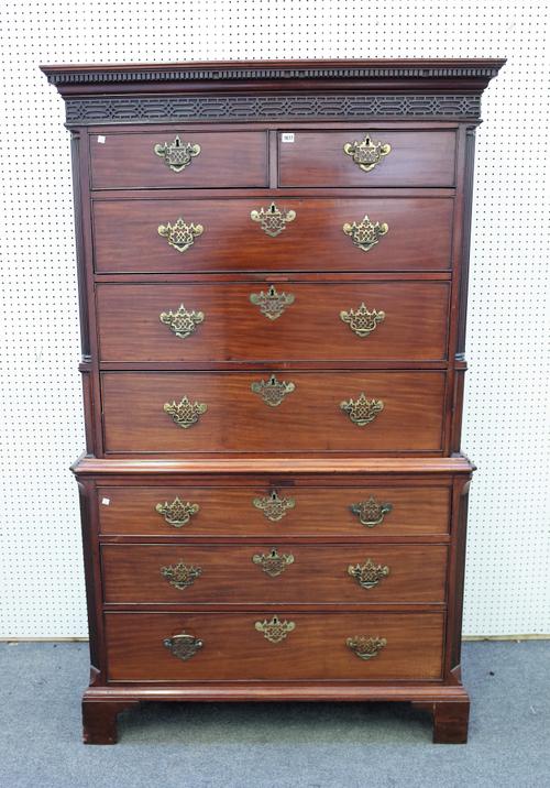 A George III mahogany dressing linen press, with blind fret cornice over two short and six long graduated drawers, one with extensive fitted interior