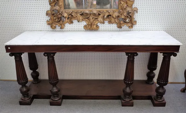 A 19th century and later serving table, the rectangular marble top on six fluted mahogany supports, united by platform undertier, 197cm wide x 87cm hi
