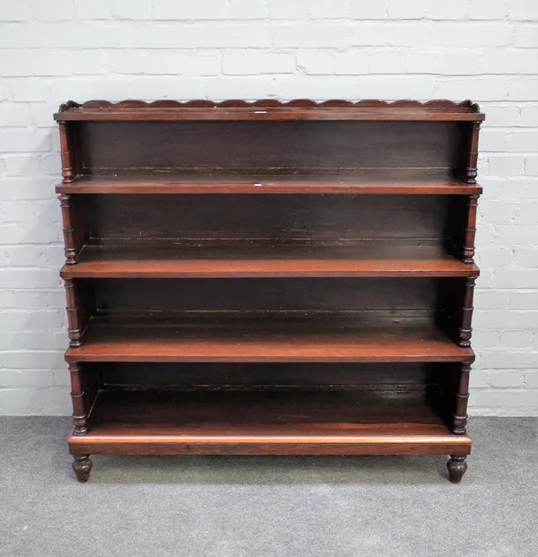 A George IV rosewood floor standing waterfall five tier open bookcase with turned supports, 122cm wide x 118cm high x 32cm deep.