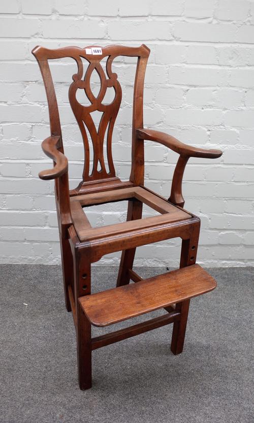 An early 19th century mahogany child's high chair with pierced splat back and open arms on central square supports, 51cm wide x 97cm high.
