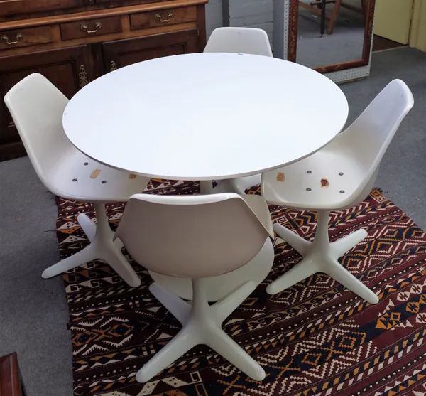 Arkana; a white painted circular resin and metal dining table, on flared base, 106cm diameter x 72cm high, together with four matching swivel chairs,