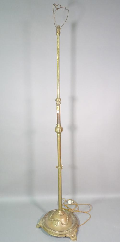 A Regency style brass standard lamp on plinth base with acanthus decoration, 172cm high.   D5